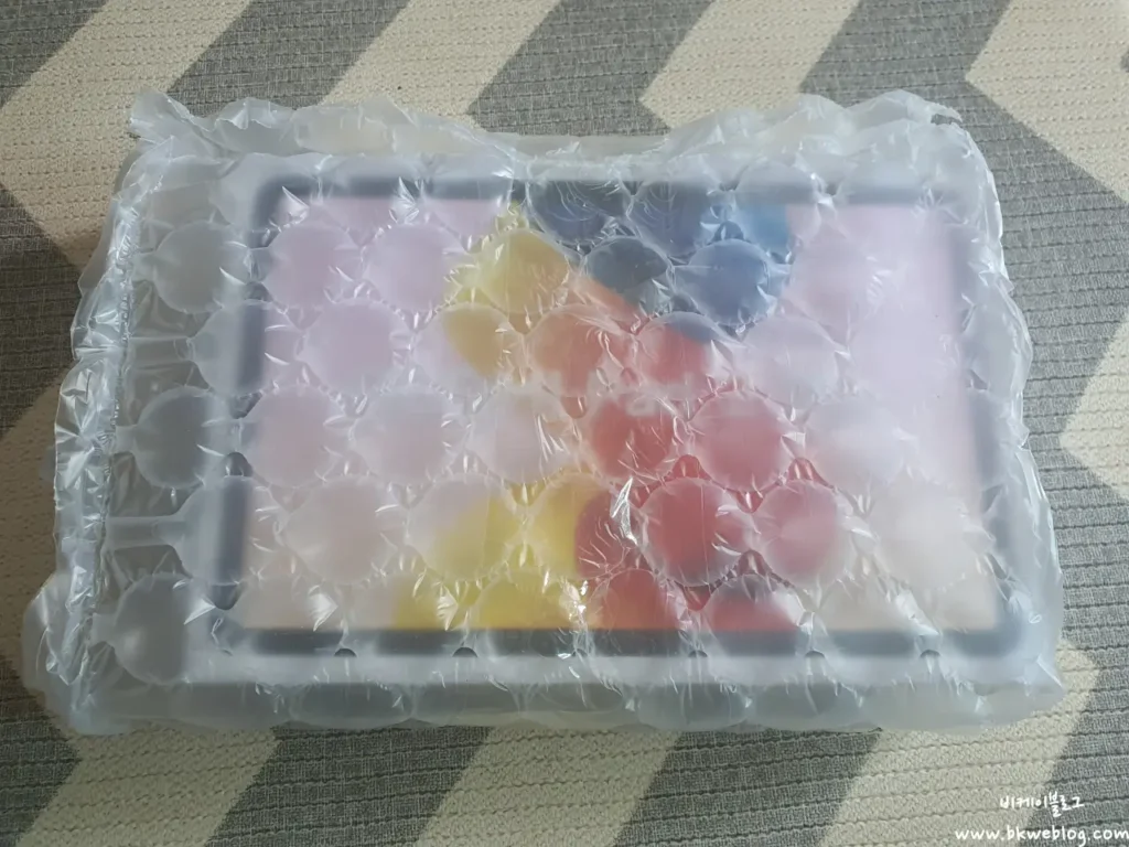 Redmi Pad 2 Pro retail box wrapped in bubble wrap for shipping