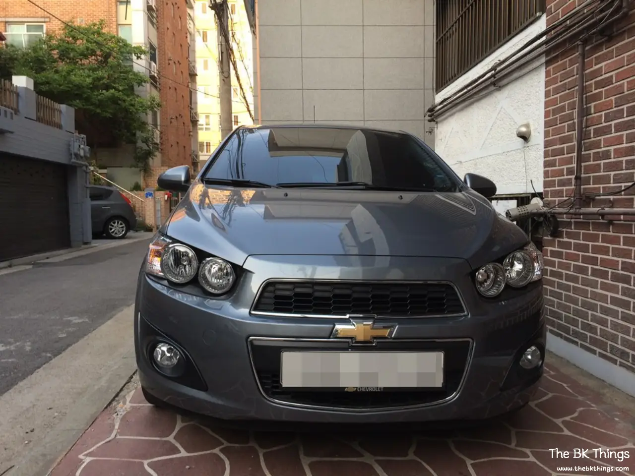Front view of a 2013 Chevrolet Aveo 1.6 sedan, sold as the Chevrolet Sonic in North America